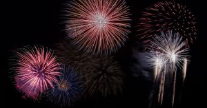 A stunning fireworks display lights up the night sky with vibrant colors.